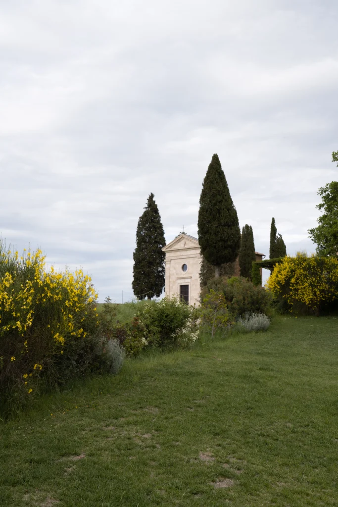 Small wedding church in Tuscany with cypress trees